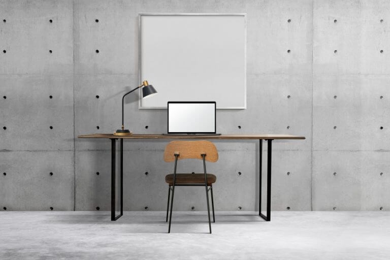industrial-home-office-interior-design-with-white-frame-hanging-on-wall-768x512(1)